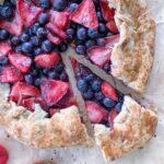 Mixed Berry Galette on a sheet of parchment paper.