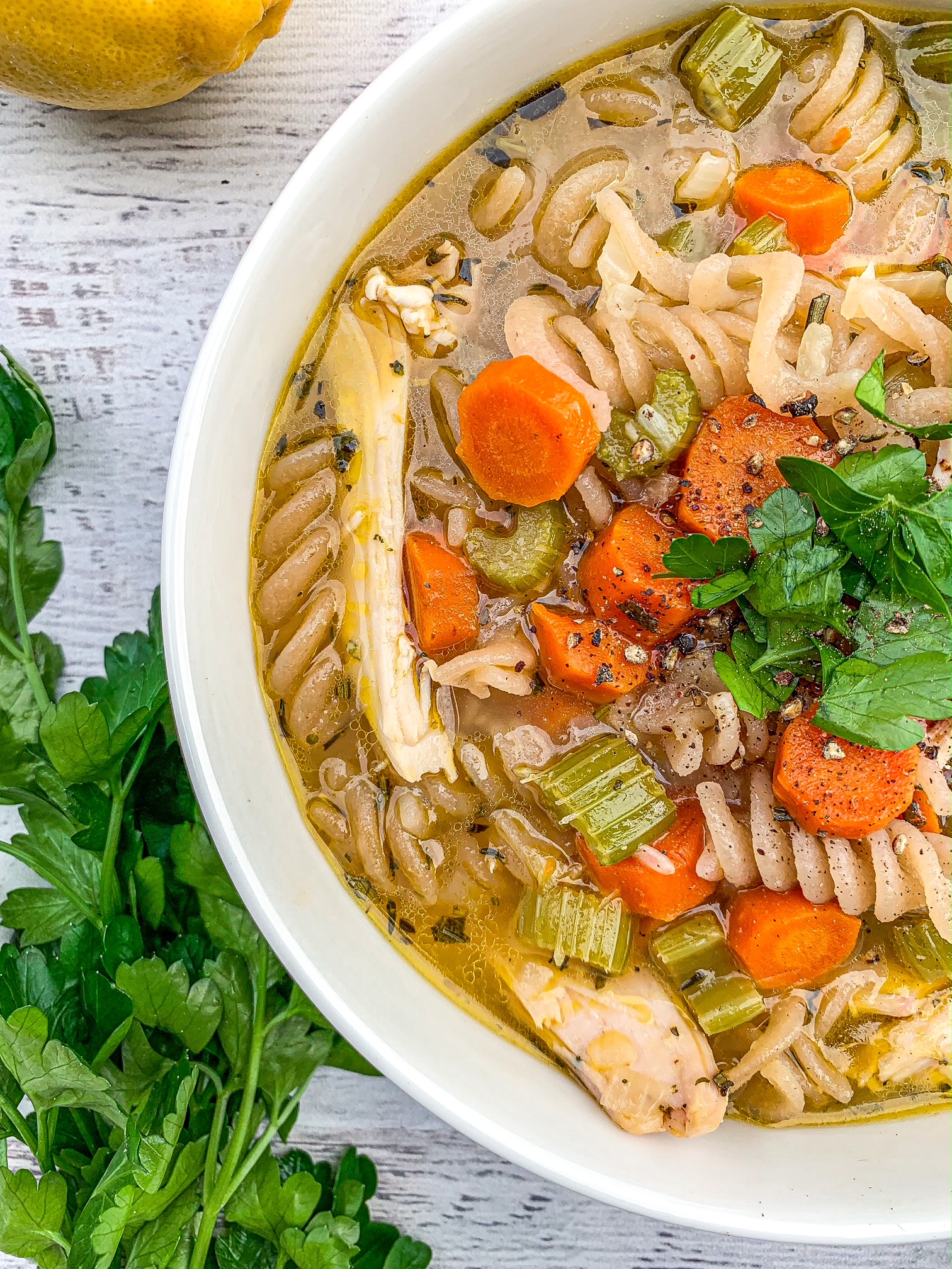 Dutch oven chicken noodle soup in a white bowl.