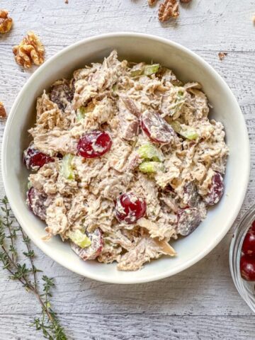 California chicken salad in a white bowl.