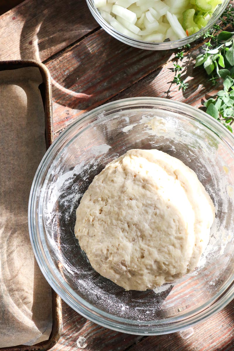 Sourdough dumpling dough in a glass bowl