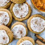 Pumpkin Spice Sugar Cookies with vanilla frosting and cinnamon on top.