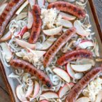 Chicken Sausage, Apples, and onions on a sheet pan.