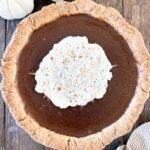 Gluten-Free Pumpkin Pie topped with whipped cream.
