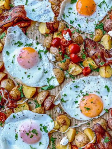 Sheet pan breakfast hash with fresh parsley and goat cheese.