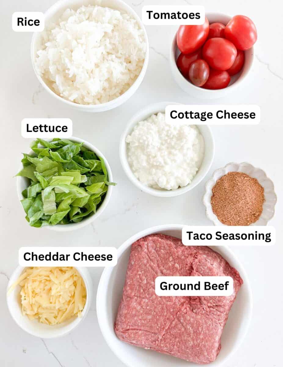 A top view of bowls containing ingredients for a taco cottage cheese bowl.