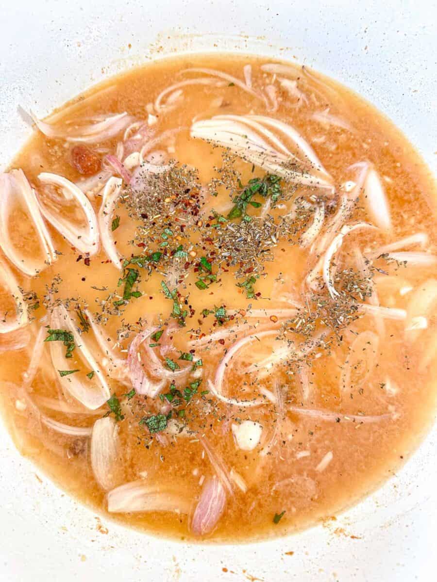 Dutch oven apple cider braising sauce for chicken thighs.