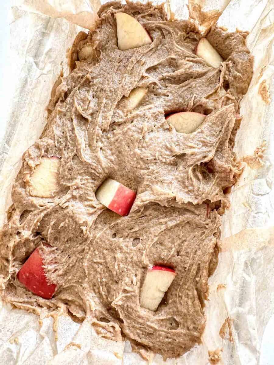 Apple Sourdough bread in a loaf pan before being baked.