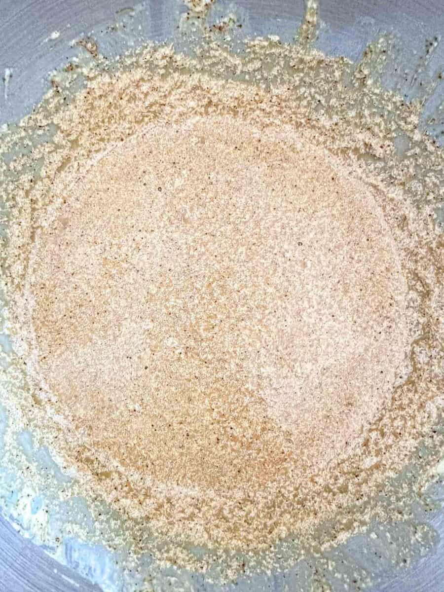 Butter and sugar creamed together in the bowl of a stand mixer.